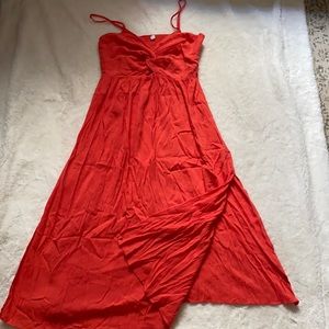 Beautiful vibrant summer dress with a slit.